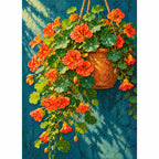 Orange nasturtiums spilling from a hanging basket: finished diamond painting on a white background