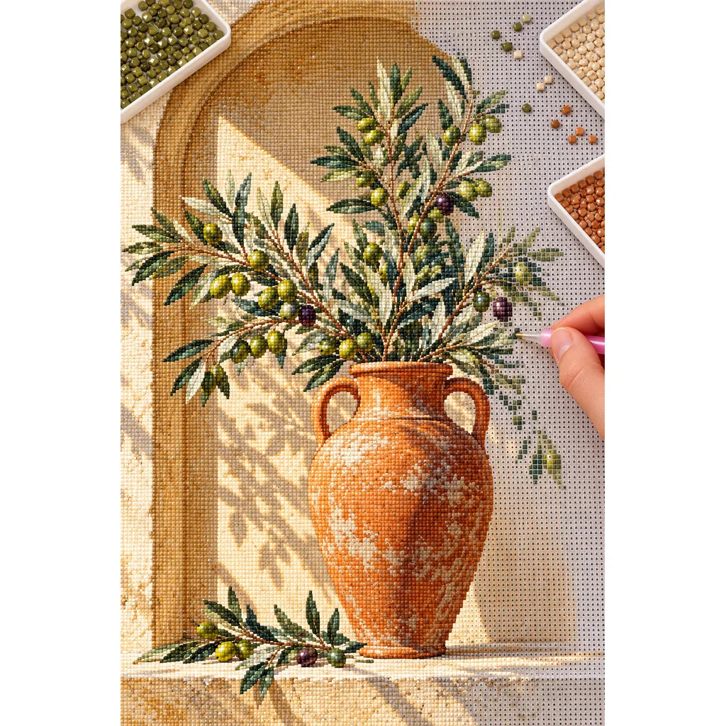 Olive branches with green and purple olives in a terracotta urn inside a sunlit arched niche: diamond painting in progress with a pen