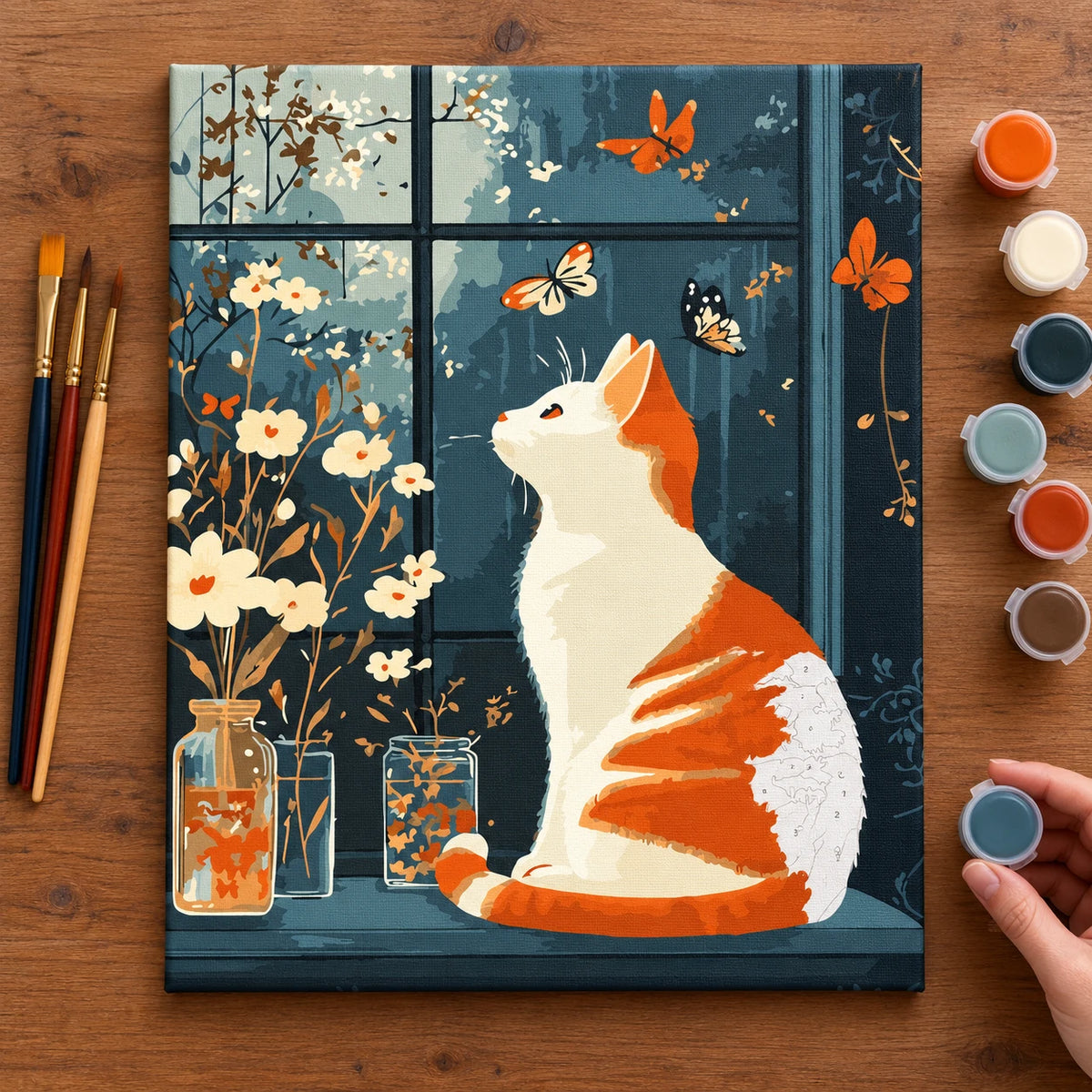 Complete Orange Cat and Butterflies numbered canvas being painted with acrylic paints and brushes