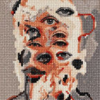 Close-up of diamond drills in the overlapping human and dog face design.