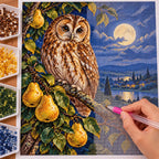 Owl with pears on a moonlit branch: diamond painting in progress with a pen