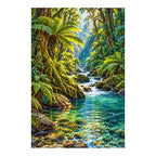 Finished diamond painting of a rainforest river and ferns on a white background.