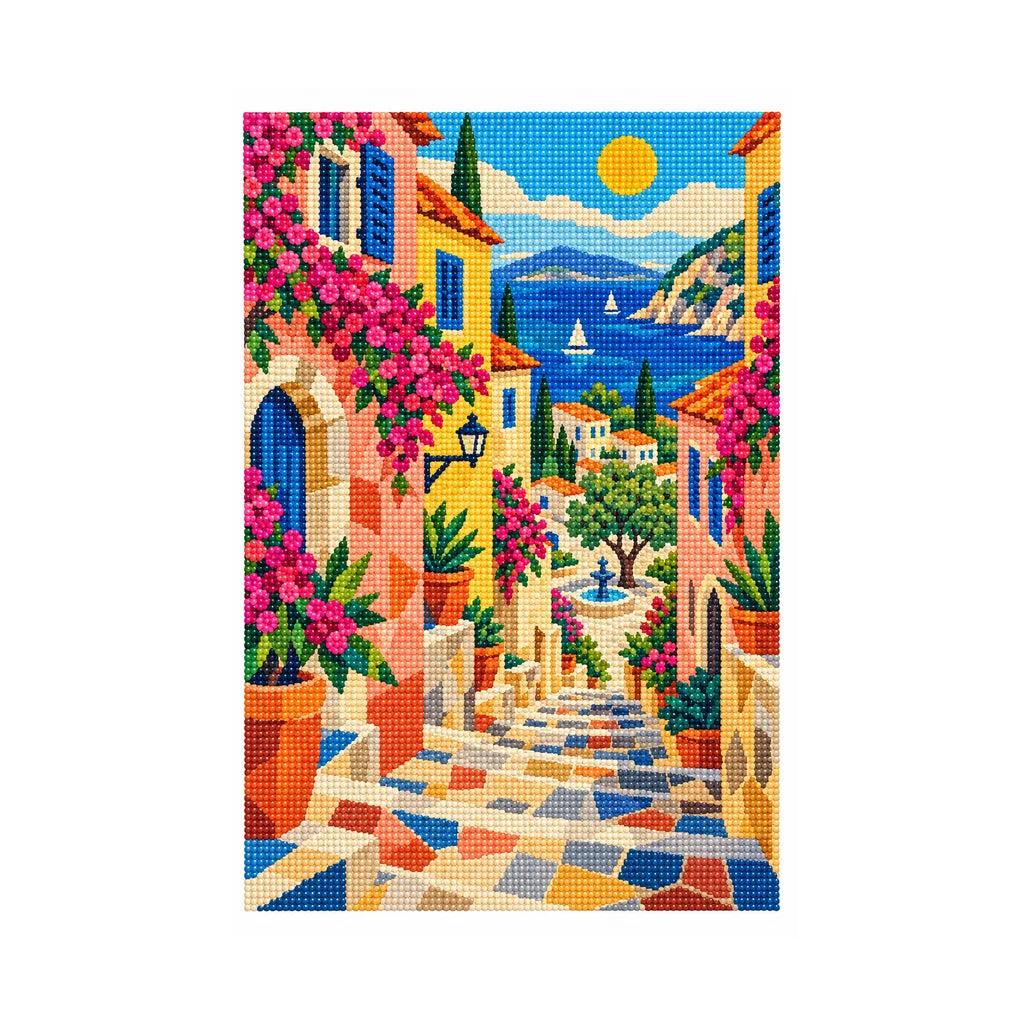 White-background finished diamond painting of a pastel French hillside village with pink flowers, blue coastal water, a sailboat, and distant mountains