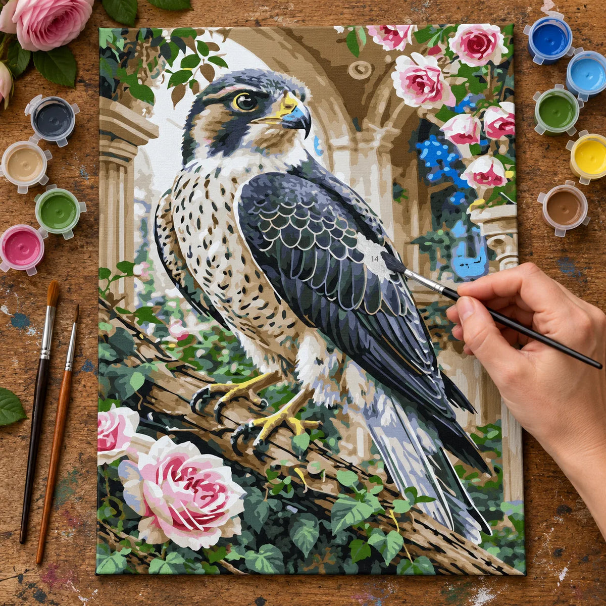 Complete Peregrine Falcon among Roses numbered canvas being painted with acrylic paints and brushes