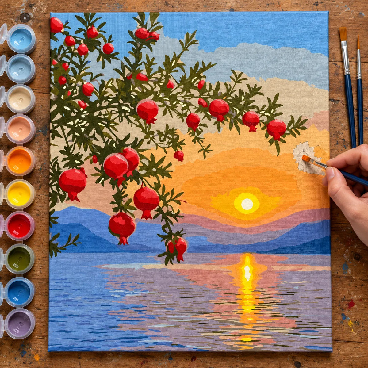 Complete Pomegranate Sunset over the Lake numbered canvas being painted with acrylic paints and brushes