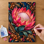Hands placing drills on the Protea Bronze Fern Frame diamond painting canvas
