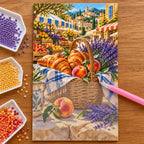 Hands placing diamond drills on the Provence Market Pastries design.