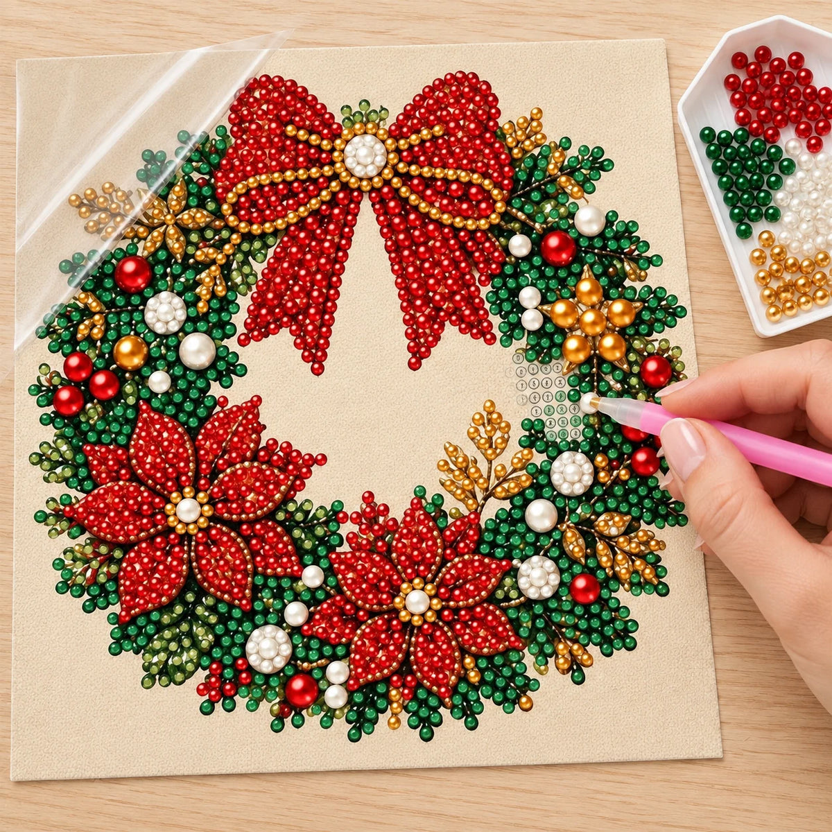 Illustrated process of placing pearls on the Red Bow Christmas Wreath printed canvas