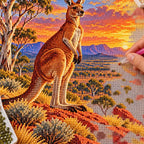 Hands placing diamond drills on the Red Outback Kangaroo design.