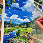 Diamond painting process for Riding Through Green Fields, with drills being placed over a cyclist and green countryside.
