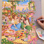 Diamond painting process showing two friends sharing a rooftop picnic beneath string lights above the city being completed with a stylus