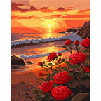 Finished diamond painting for Roses at Sunset Shore Diamond Painting Kit, showing a red roses beside a rocky shore beneath a glowing sunset.