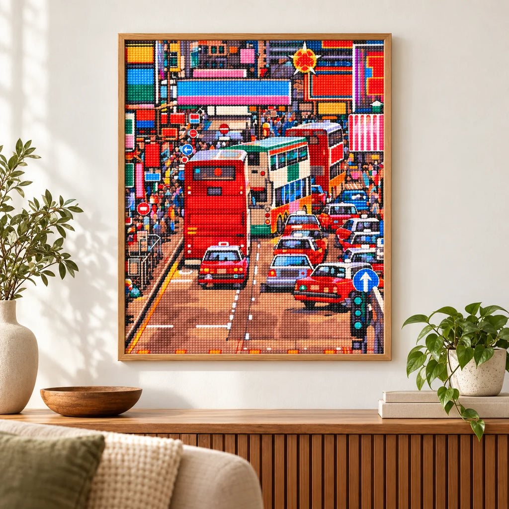 Home decor scene featuring a diamond painting of a busy Kowloon street with red double-decker buses and dense city traffic.