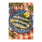 White-background finished diamond painting of sardines with lemon on a blue ceramic plate