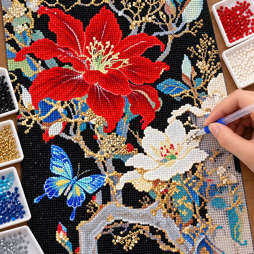 Diamond painting process for scarlet blossoms, white cosmos, and blue butterflies.