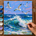 Complete Seagulls over an Ocean Wave numbered canvas being painted with acrylic paints and brushes
