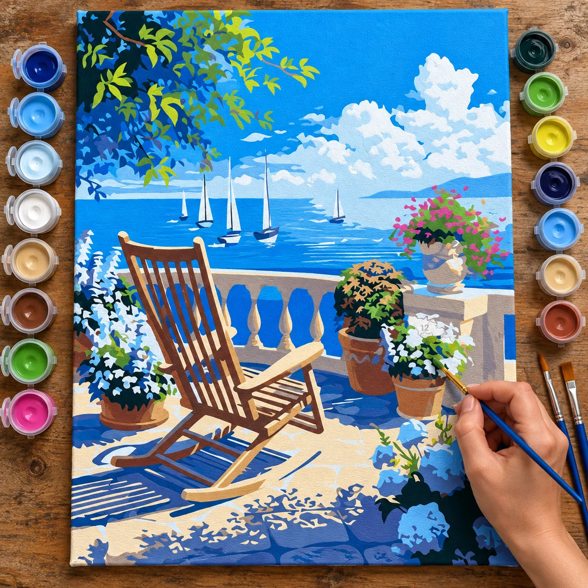 Complete Seaside Terrace with Sailboats numbered canvas being painted with acrylic paints and brushes