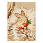 White-background diamondized artwork of a sleeping white bunny cuddling a carrot in bed