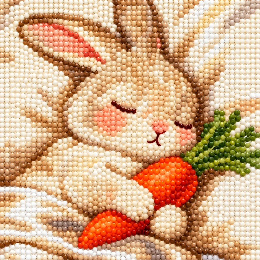Close-up diamond drill detail of the bunny’s face and carrot