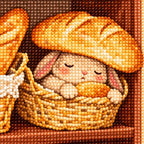 Close-up diamond drill detail of the sleepy bunny and woven bread basket