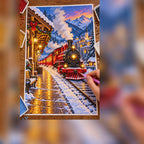 Diamond painting process showing a glowing red steam train arriving at a snowy station at night being completed with a stylus