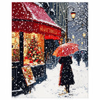 Finished diamond painting of a couple beneath an umbrella on a snowy Paris cafe street.