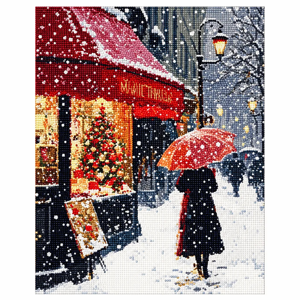 Finished diamond painting of a couple beneath an umbrella on a snowy Paris cafe street.