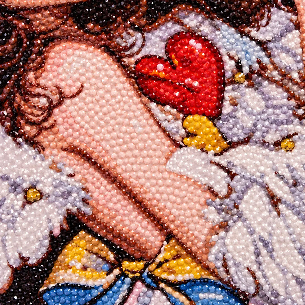 Close-up diamond drill detail of the girl, red heart, and white wings