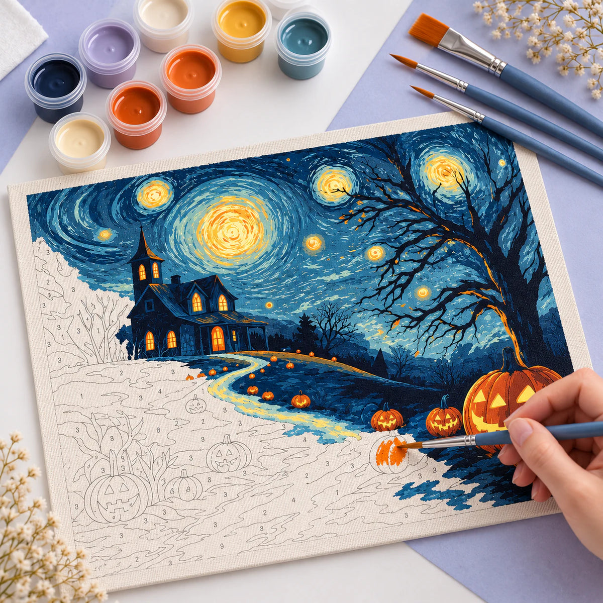 Complete Starry Night Halloween numbered canvas being painted with acrylic paints and brushes