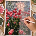 Diamond painting process for Sunlit Tulip Reflection, showing drills being placed over pink tulips reflected in a pond beneath warm sunlight.