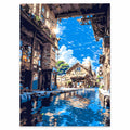 Original artwork for Sunlit Village Passage Diamond Painting Kit, showing a sunlit stone passage opening onto blue water between old village buildings.