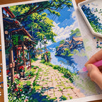 Diamond painting process for Sunlit Village Walkway, with drills being placed over a stone walkway winding through a leafy village lane.
