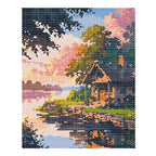 Finished diamond painting of a quiet cabin and wooden dock beside sunset water under leafy trees.