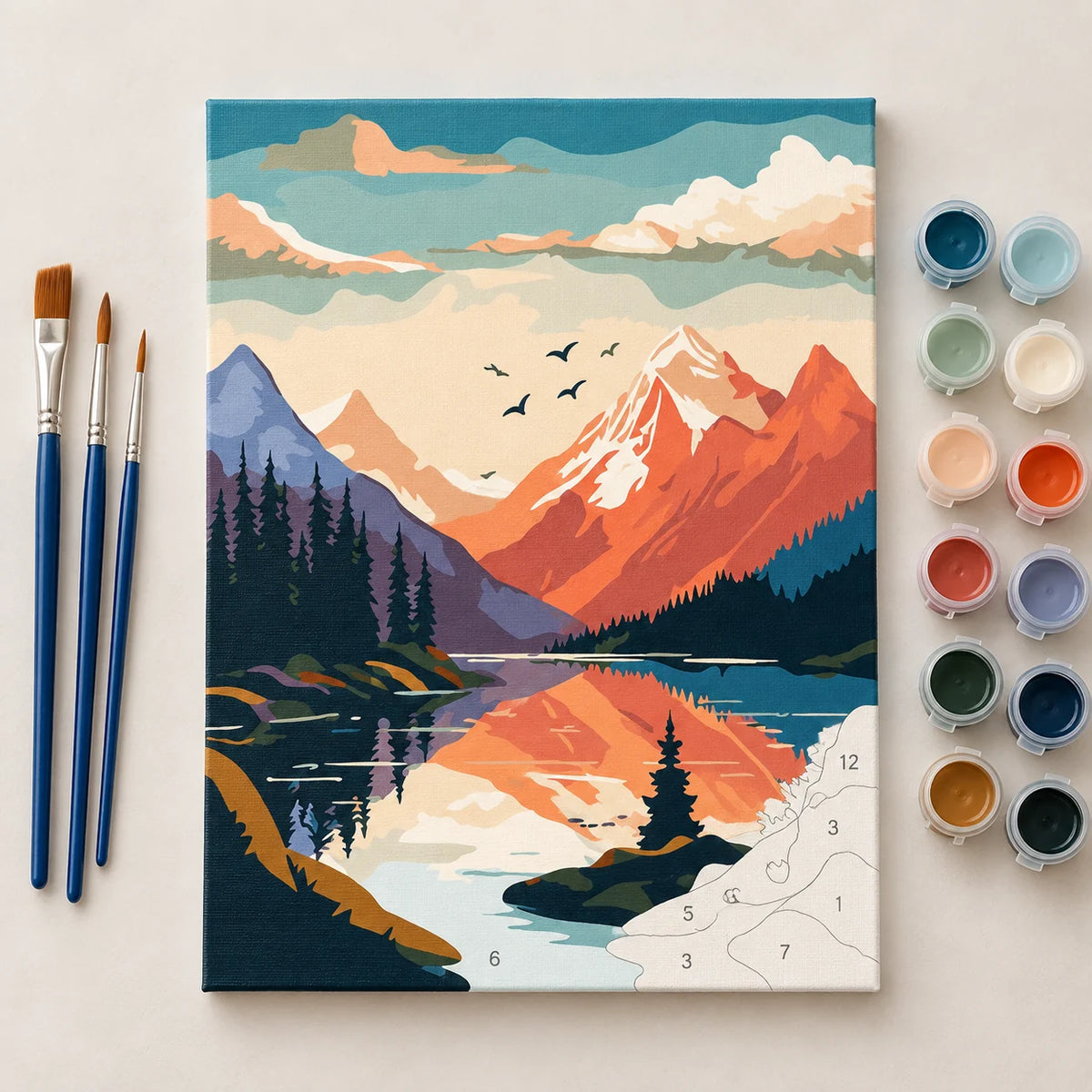 Complete Sunset Mountain Lake Reflection numbered canvas being painted with acrylic paints and brushes