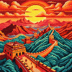 Close-up of drill texture and details in the Great Wall winding across mountain ridges beneath a red-orange sunset.