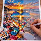 Diamond painting process for Sunset Through the Crystal Heart Diamond Painting Kit, with hands applying drills over a heart-shaped opening among colorful beach stones framing a glowing sunset.