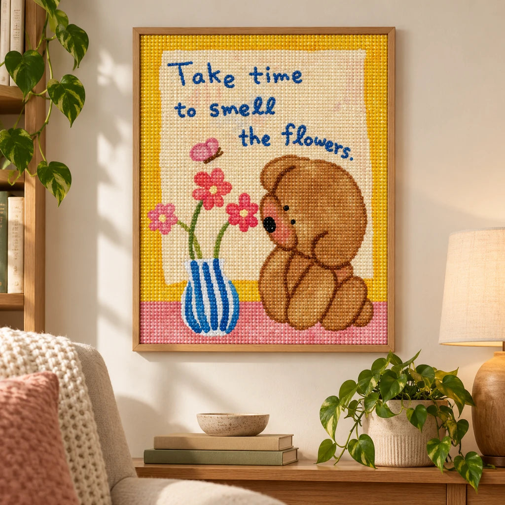Framed bear and flowers diamond painting with the Take time to smell the flowers message displayed as home decor
