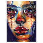 Original cubist artwork of a tear-streaked woman in vivid red, blue, and gold tones.