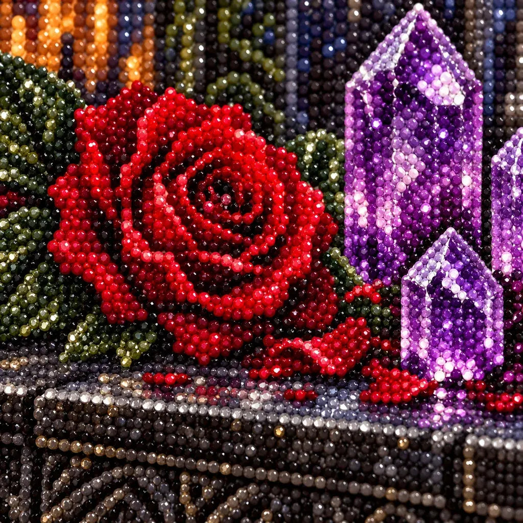 Close-up of diamond drills on a red rose and amethyst crystal.