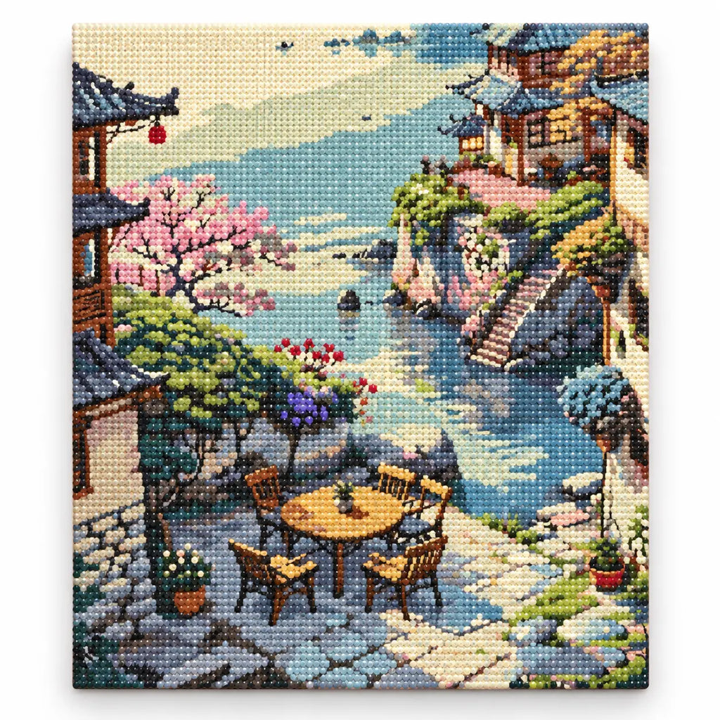 Finished diamond painting of Tranquil Riverside Village with sparkling drills