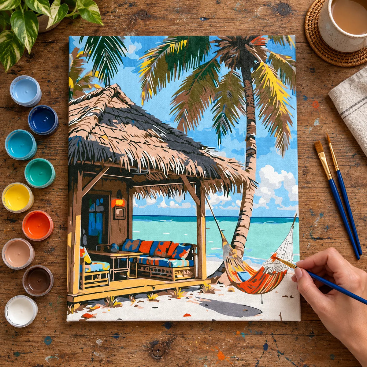 Complete Tropical Beach Hut and Hammock numbered canvas being painted with acrylic paints and brushes