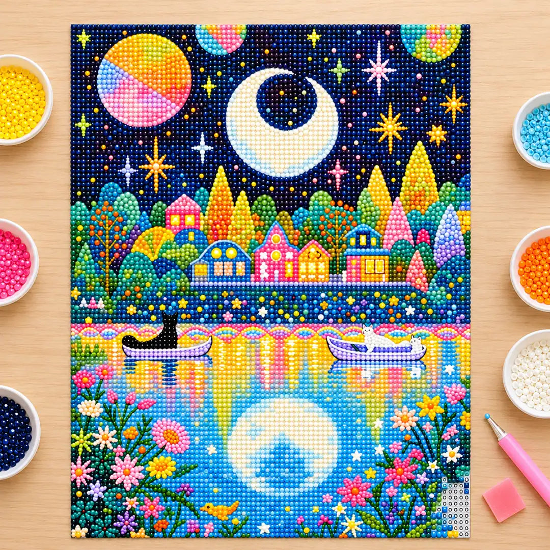 Diamond painting process showing cats in boats on a moonlit lake being completed with a stylus