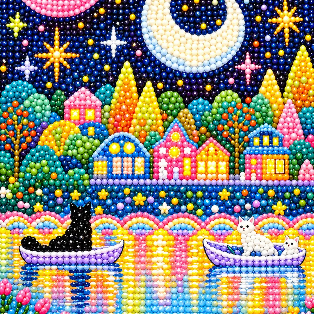 Close-up of cats in boats beneath the crescent moon and village lights