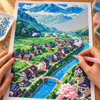 Hands placing diamond drills while working on the Valley Of Blossoms diamond painting.