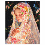 Finished diamond painting of a veiled woman in a flower crown with eyes closed in a quiet moment.
