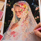 Diamond painting process for Veiled Floral Prayer, with drills being placed over a veiled woman in a flower crown with eyes closed in a quiet moment.