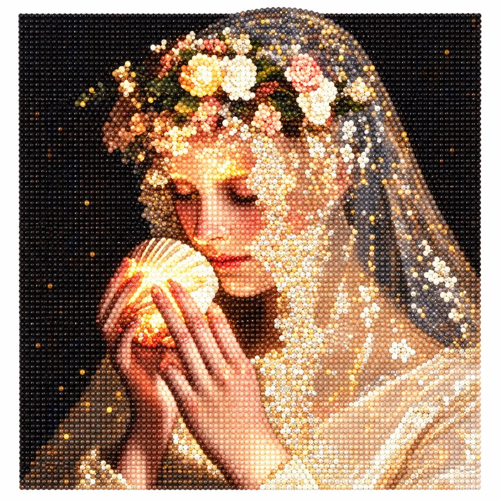 Finished diamond painting of a veiled woman holding a glowing shell decorated with flowers.