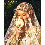 Finished diamond painting of a veiled maiden holding a pale seashell amid delicate blossoms.