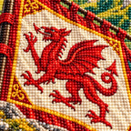 Close-up of faceted drills forming the red dragon banner and castle