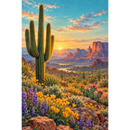 Original white-background artwork of a tall saguaro among desert wildflowers with red mesas at sunset.